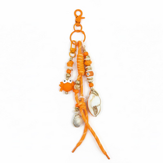 Grigri crabe et coquillage orange